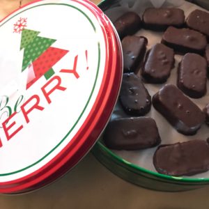 Chocolate and coconut candy in a Christmas tin