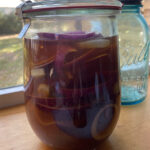 Completed fermented red onions in jar