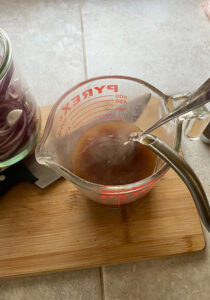 Pour boiled water over the apple cider vinegar, coconut sugar and salt