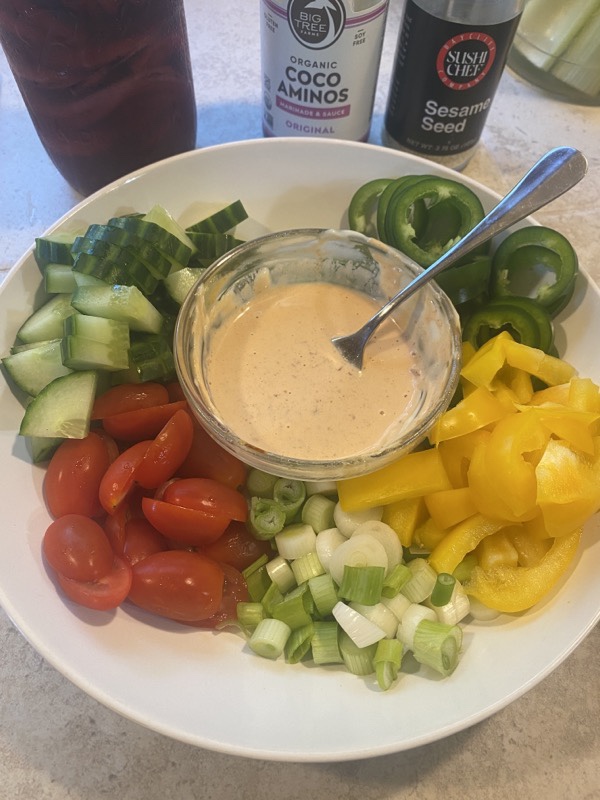 Prepared veggies and spicy mayo for the poke bowl