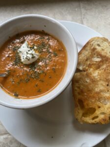 Healthy Homemade Tomato Soup with grilled cheese on the side