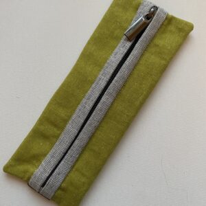 Premium Cotton Fabric in leaf green with white and white zipper binding and gunmetal zipper hardware.